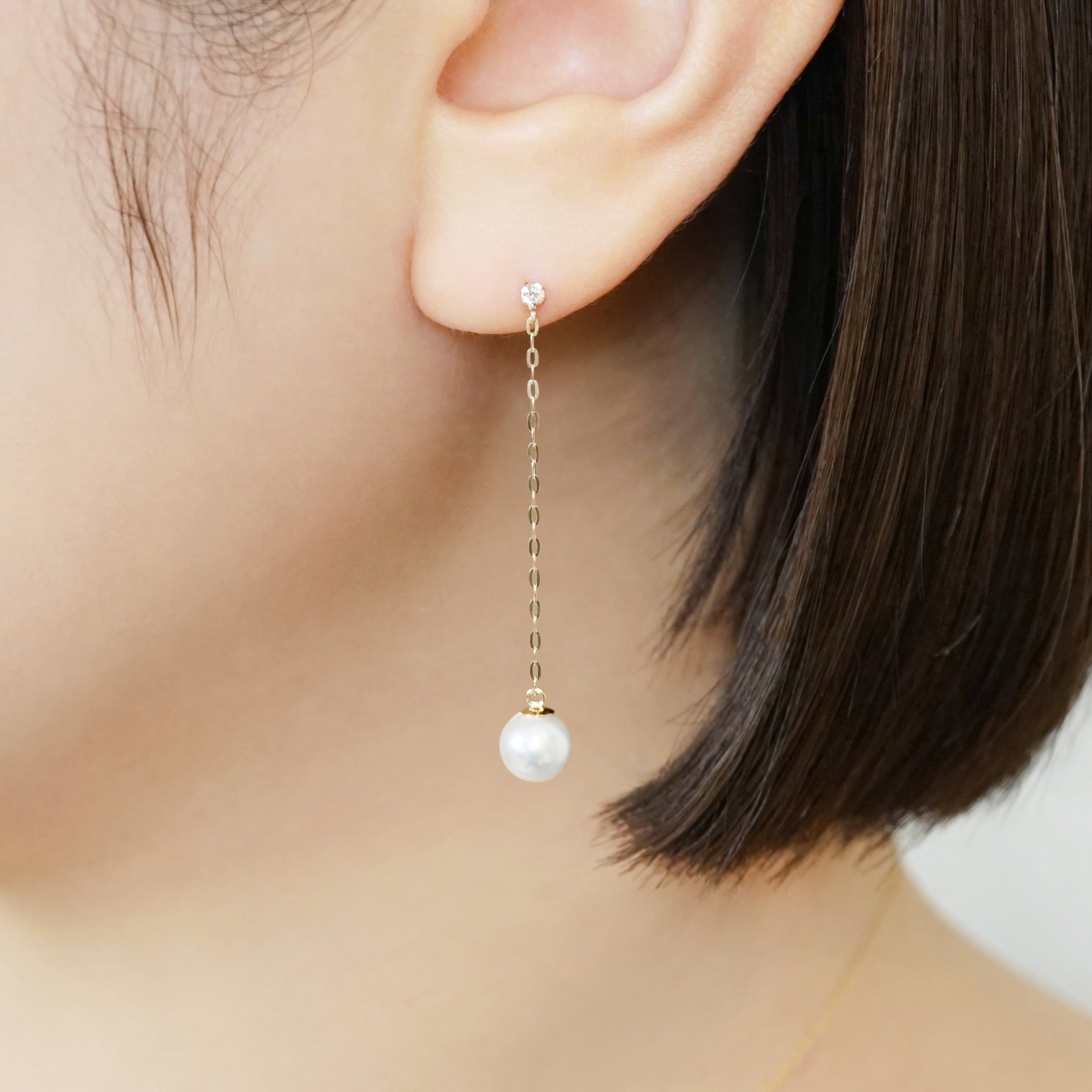 10K Shell Pearl Long Dangle Earrings (Yellow Gold) - Model Image