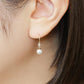 10K Shell Pearl Wire Earrings (Yellow Gold) - Model Image