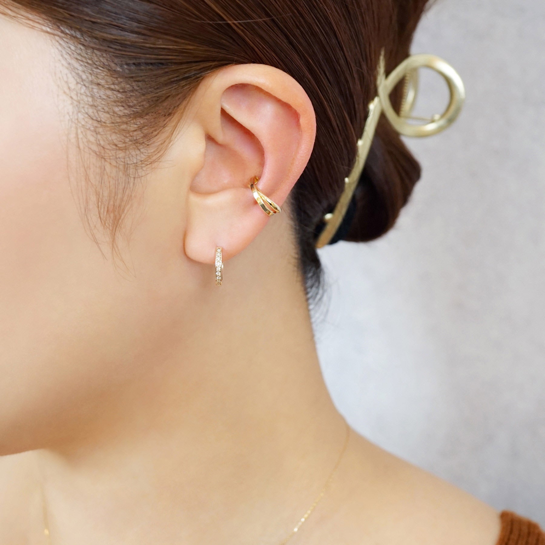 10K Crossed Oval Ear Cuff (Yellow Gold) - Model Image