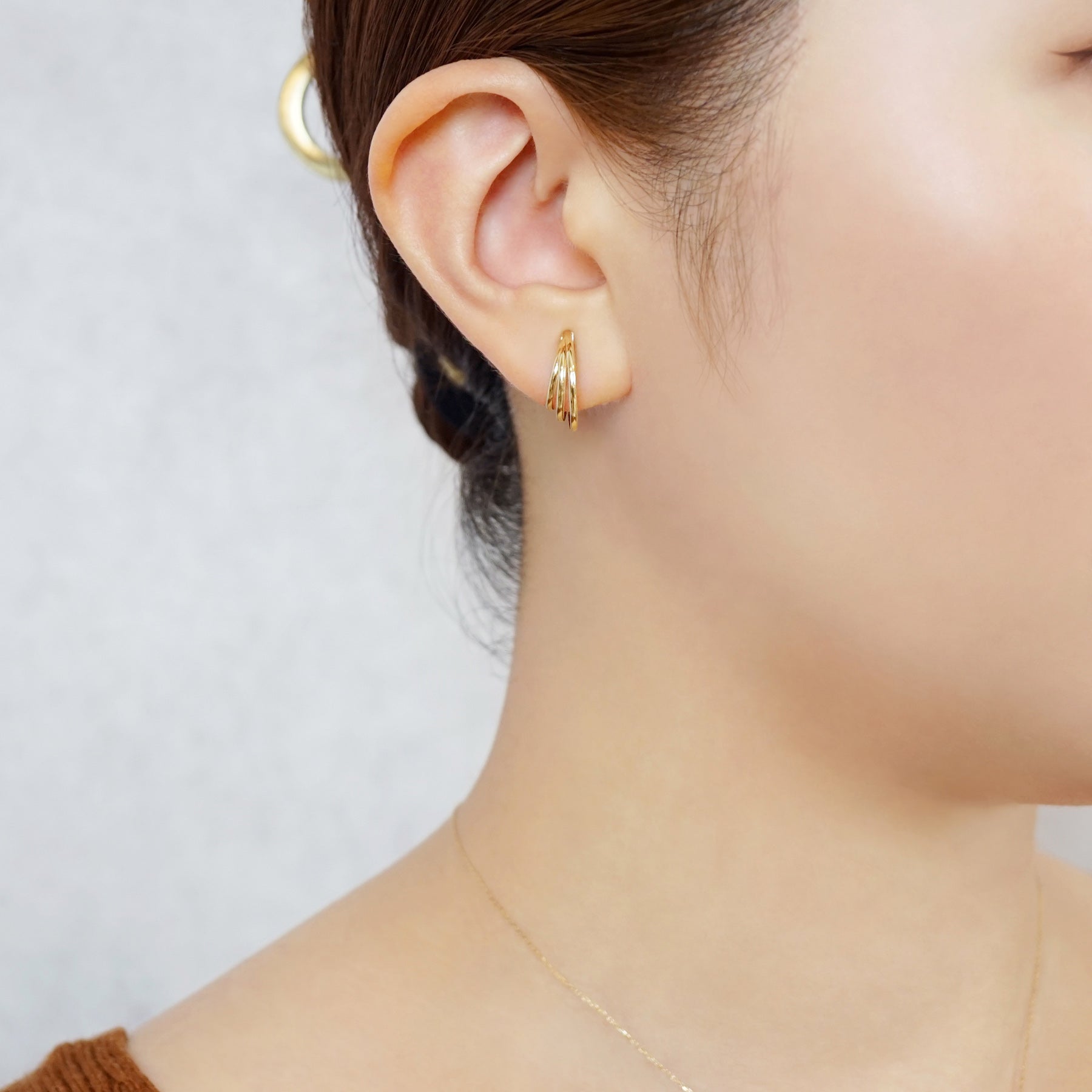 10K Triple Hoop Clip-On Earrings (Yellow Gold) - Model Image