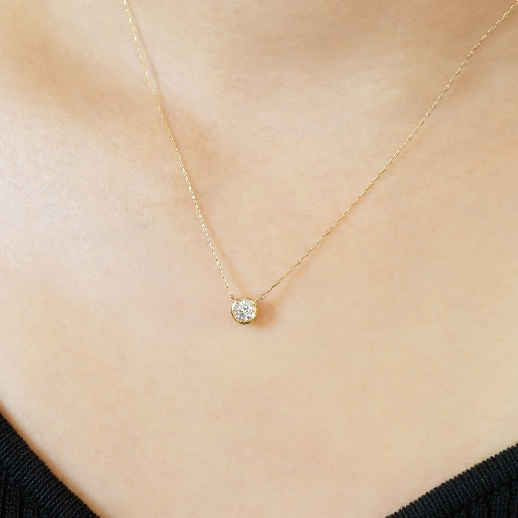 10K Moissanite Solitaire Necklace (Yellow Gold) - Model Image