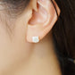 Carved Cat White Shell Ceramic Post Earrings - Model Image