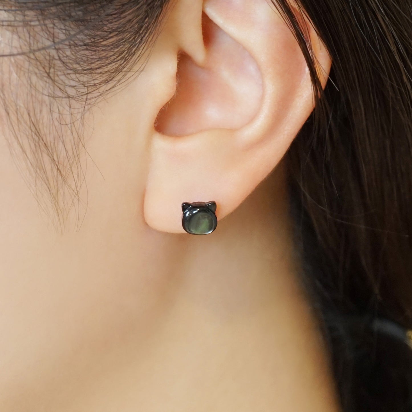 Carved Cat Black Shell Ceramic Post Earrings - Model Image