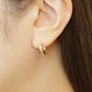 18K/10K Flower Cut Cross Hoop Earrings (Yellow Gold) - Model Image