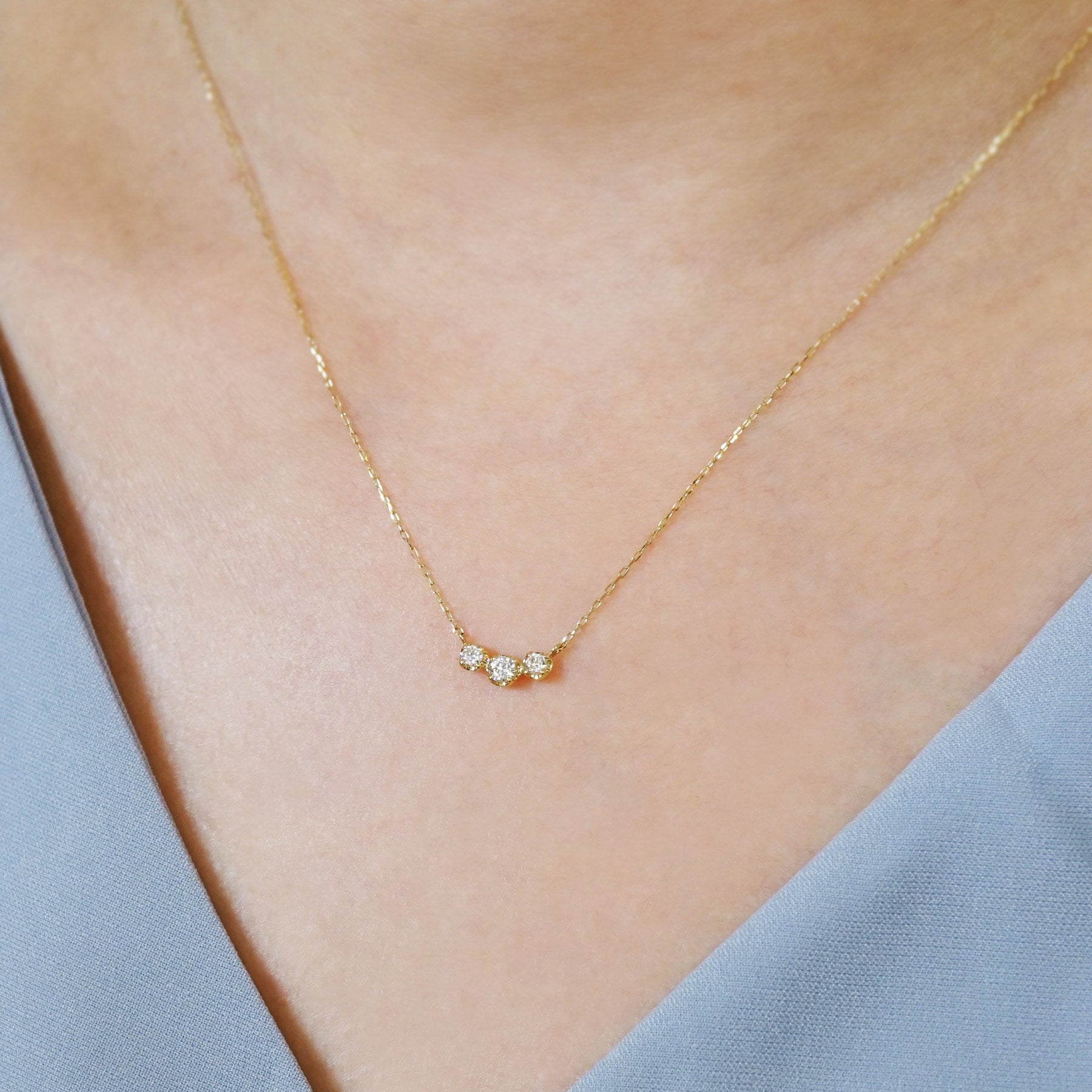 10K Moissanite Trilogy Necklace (Yellow Gold) - Model Image