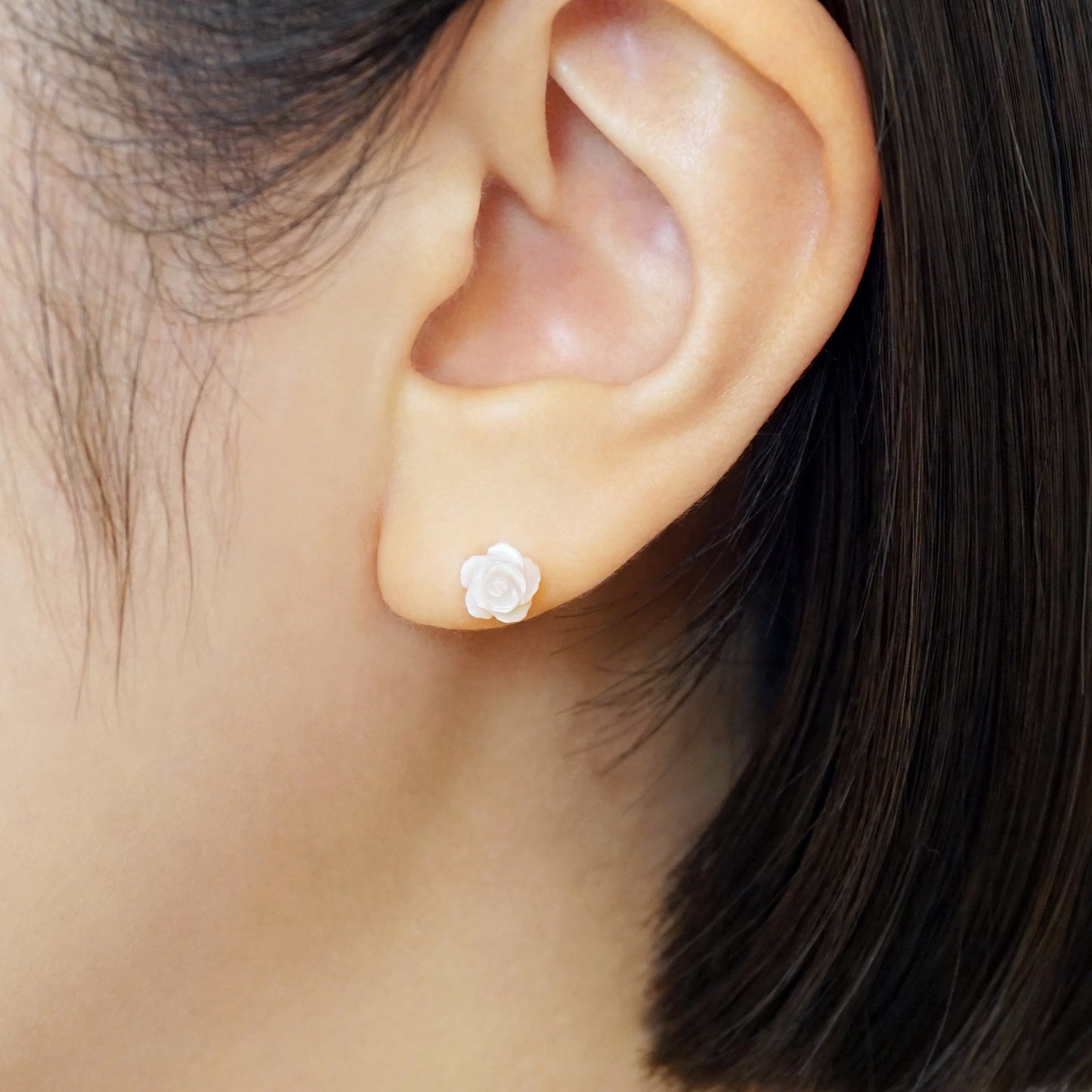 Carved Rose Pink Shell Ceramic Post Earrings - Model Image