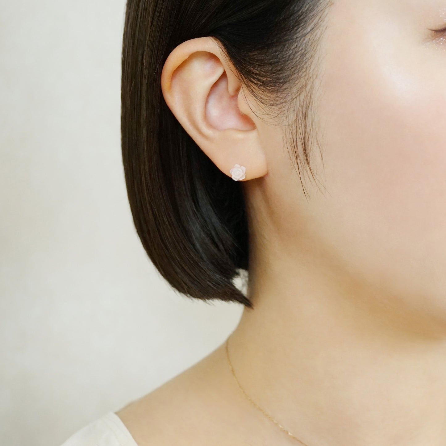 Carved Rose Pink Shell Ceramic Post Earrings - Model Image