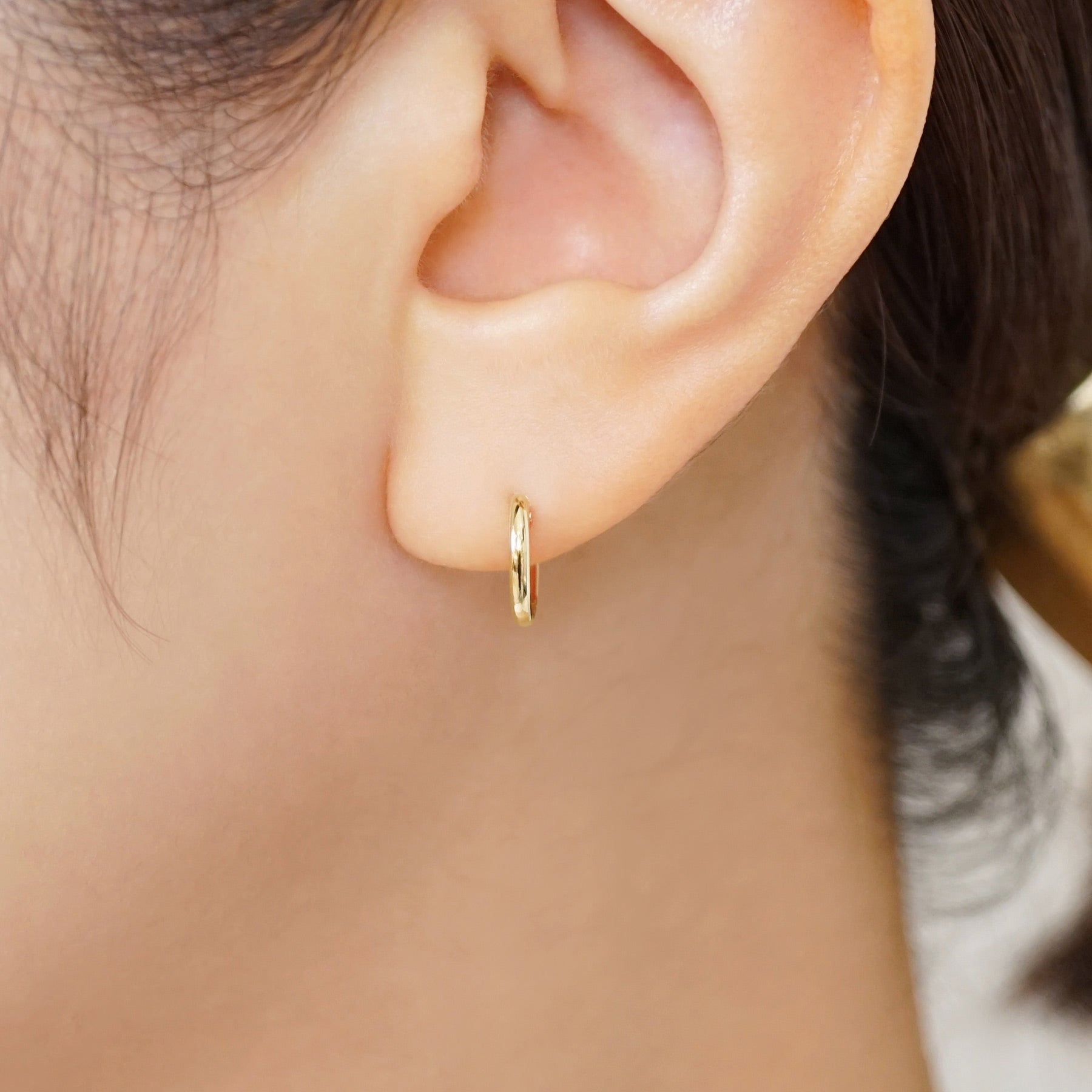 18K/10K Mini Hoop Earrings (Yellow Gold) - Model Image