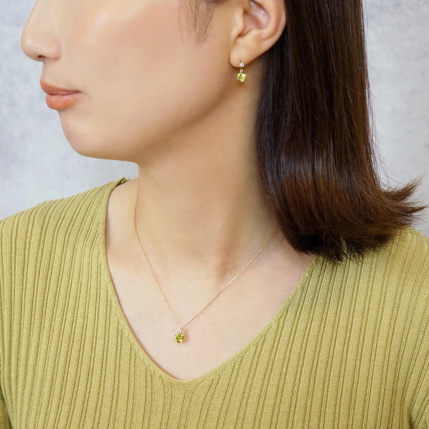 10K Trilliant Peridot Necklace (Yellow Gold) - Model Image