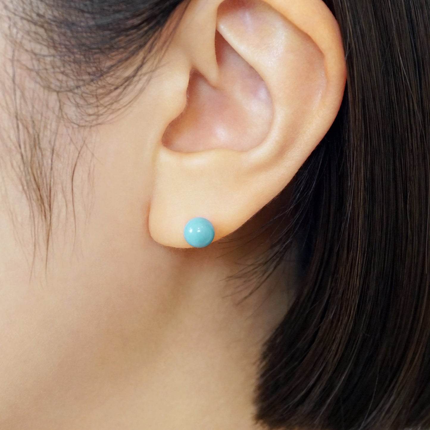 Turquoise Color Ball Ceramic Post Earrings - Model Image