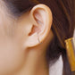 10K White Gold Glittering Wave Ear Cuff - Model Image